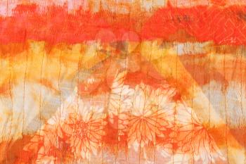 painted striped orange silk batik close up