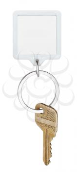 one door brass key and square keychain on ring isolated on white background