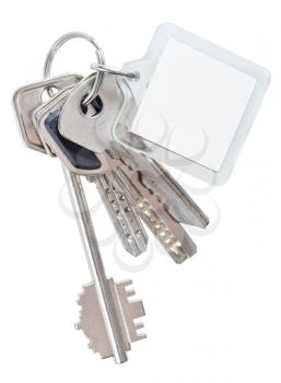 several keys on steel ring and keychain isolated on white background