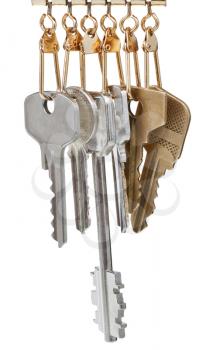 several different door keys on pendants isolated on white background