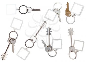 collection of keys on ring with blank keychain isolated on white background