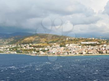 view of town Reggio di Calabria from Strait of Messina, Italy in summer day