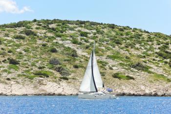 yacht with white sail near Dalmatia coast in Adriatic sea, Croatia