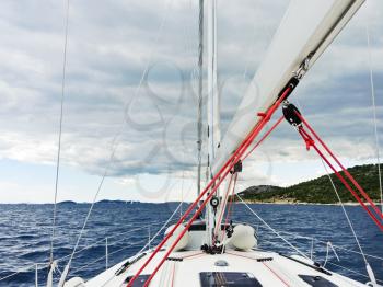 voyage on yacht in Adriatic sea over rainy clouds, Dalmatia, Croatia