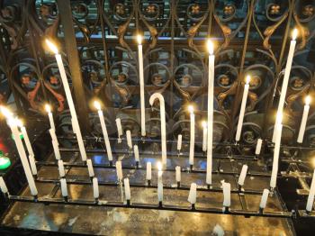 Lighted candles on altar of cathedral, Amiens, France