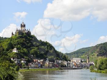 view of Cochem on Moselle river and Cochem Imperial castle over town in Germany