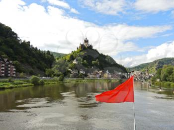 red flag and Cochem town on Moselle river in Germany