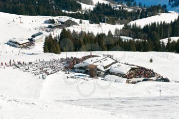 view of mountain restaurants and downhill ski slopes in Saalbach Hinterglemm region, Austria