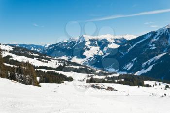 view of skiing area and downhill ski slopes in Saalbach Hinterglemm region, Austria