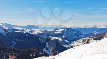 ski lift and panorama of Dolomites mountains in Val Gardena, Italy