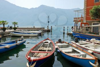 boats near pier in town limone sul garda, Lake Garda, Italy