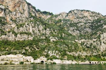rocky shores of Lake Garda, Italy in summer day