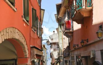 narrow street to Lake Garda in Malcesine town, Italy