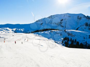 ski run on snow slopes of mountains in sunny day in Portes du Soleil region, Morzine - Avoriaz, France
