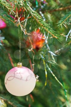 pink ball and red balls christmas tree vintage decoration close up