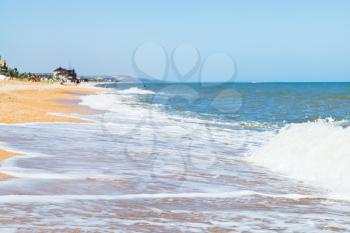 sand and seashells beach of Sea of Azov in resort town Golubickaya, Taman Peninsula, Russia