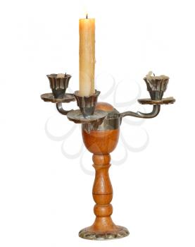 triple candlestick with one burning candle isolated on white background