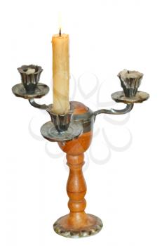 triple candlestick with one lighted candle isolated on white background