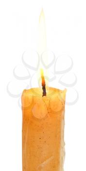 lighted stearin candle close up isolated on white background
