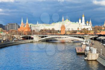 dark blue clouds over illuminated Moscow Kremlin and Moskva River in autumn day