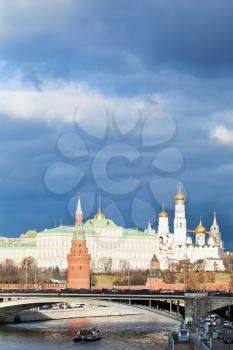 dark blue clouds over illuminated Moscow Kremlin in autumn day