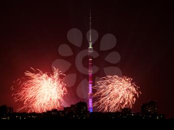 Night view of Moscow city with Ostankino TV Tower and red fireworks