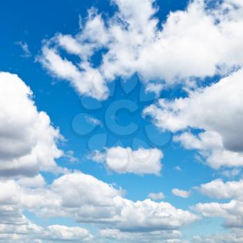 woolpack clouds in blue sky in summer day