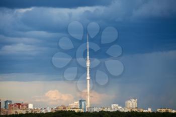dark blue rain clouds over TV tower in summer evening, Moscow