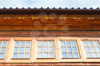 windows of wooden log tower of Great Wooden Palace in russian village Kolomenskoe, Moscow