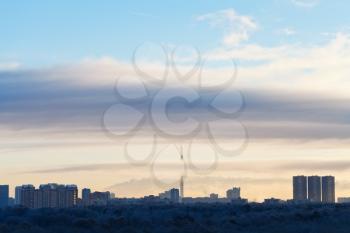early morning cloudscape over city park in cold blue winter dawn, Moscow