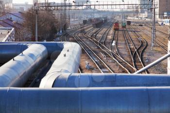 industrial landscape with pipeline and railway lines in spring day