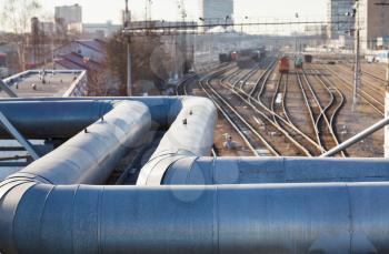 industrial view with pipeline and railway lines in spring day