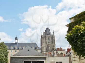 view of Saint-Aubin Tower over roof of urban houses in Angers city, France