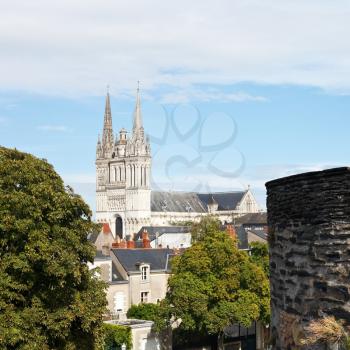 skyline with Saint Maurice Cathedral and wall of Angers Castle, France