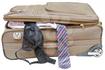 textile suitcase with fell out male tie and female bra isolated on white background