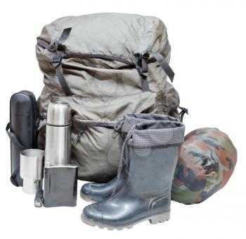 set of camping equipment with backpack, gumboots, thermos, knife, flask, can, sleeping bag isolated on white background