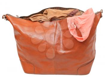 big leather handbag with blouse and pink lace panties isolated on white background