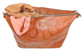ajar leather bag with blouse and pink lace panties isolated on white background