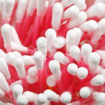 Many pink cotton swabs close up