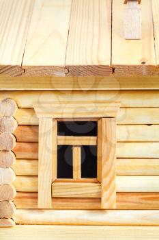 window of model of simple village wooden log house isolated on white background