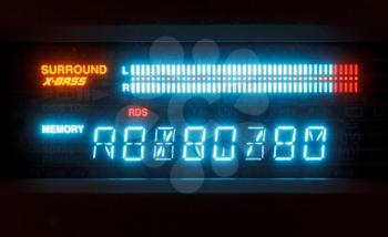 scale of sound volume on blue indicator board of radio receiver close up