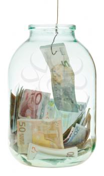catching saving euro money from glass jar isolated on white background