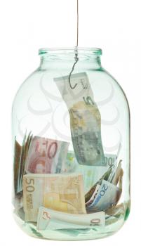 fishing out saving euro money from glass jar isolated on white background