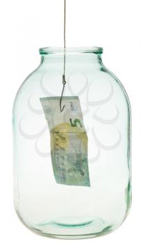 catching the last euro banknote from glass jar isolated on white background
