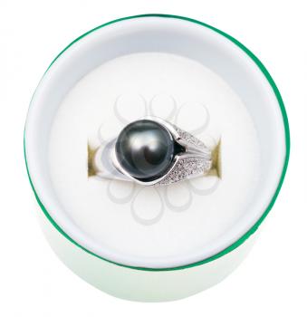 top view of white gold ring with black pearl in green box isolated on white background