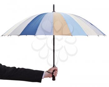 male hand hold open multicolored umbrella isolated on white background