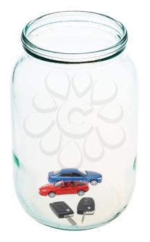 two new vehicles with keys in open glass jar