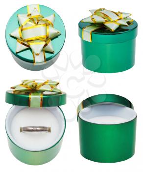little round green box with wedding platinum ring isolated on white background