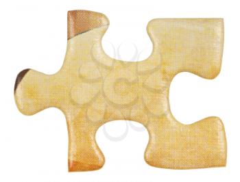 cardboard yellow piece of jigsaw puzzle close up isolated on white background