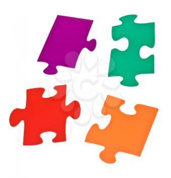 four separated jigsaw puzzle pieces isolated on white background